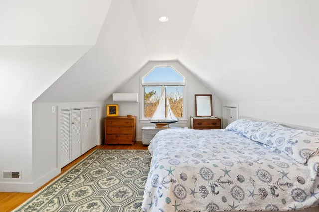 a bedroom with a bed and a dresser