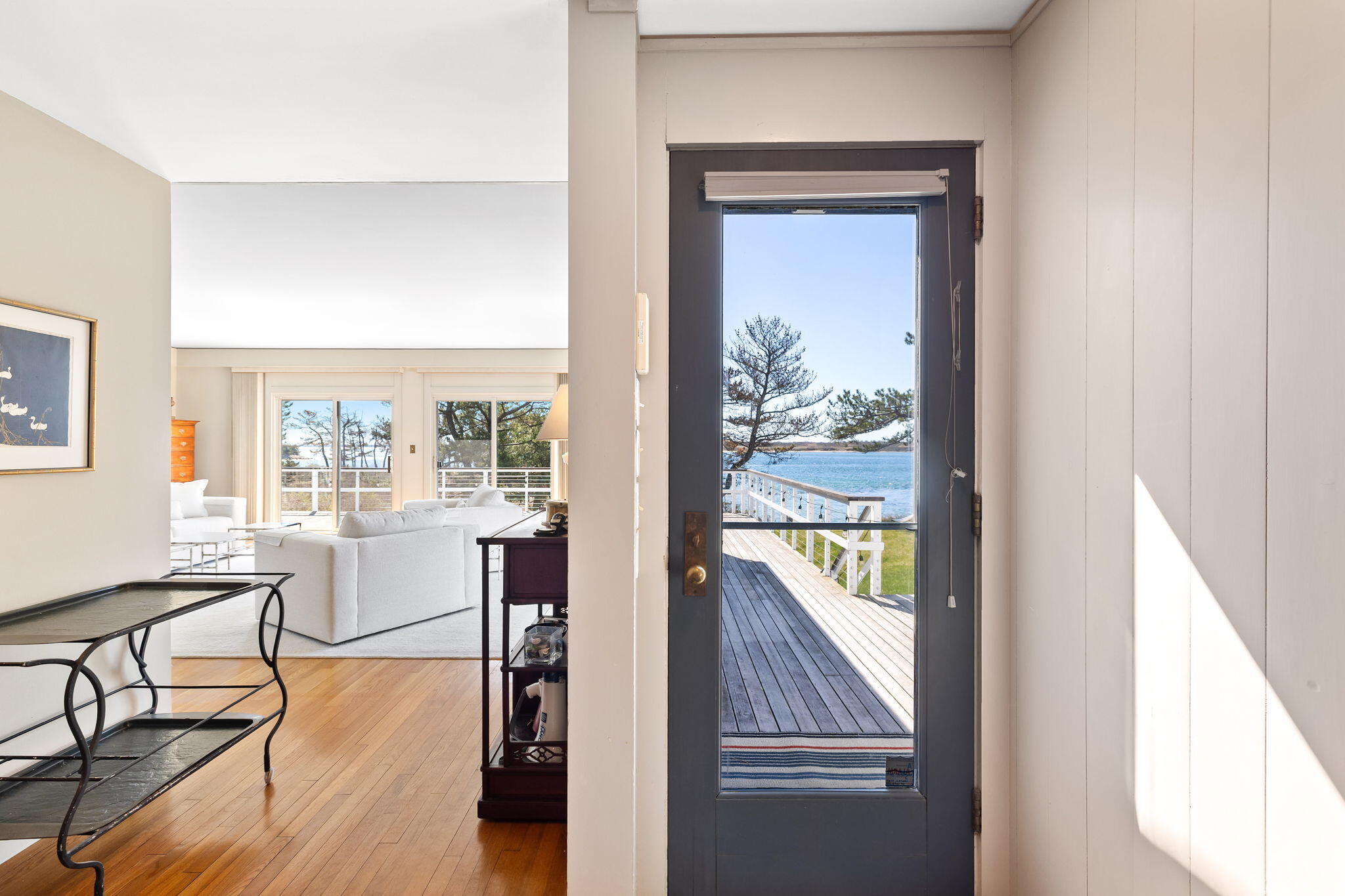 169 Penzance Road Woods Hole, MA 02543 - Photo 10 of 41 a view of a hallway with wooden floor and dining room view