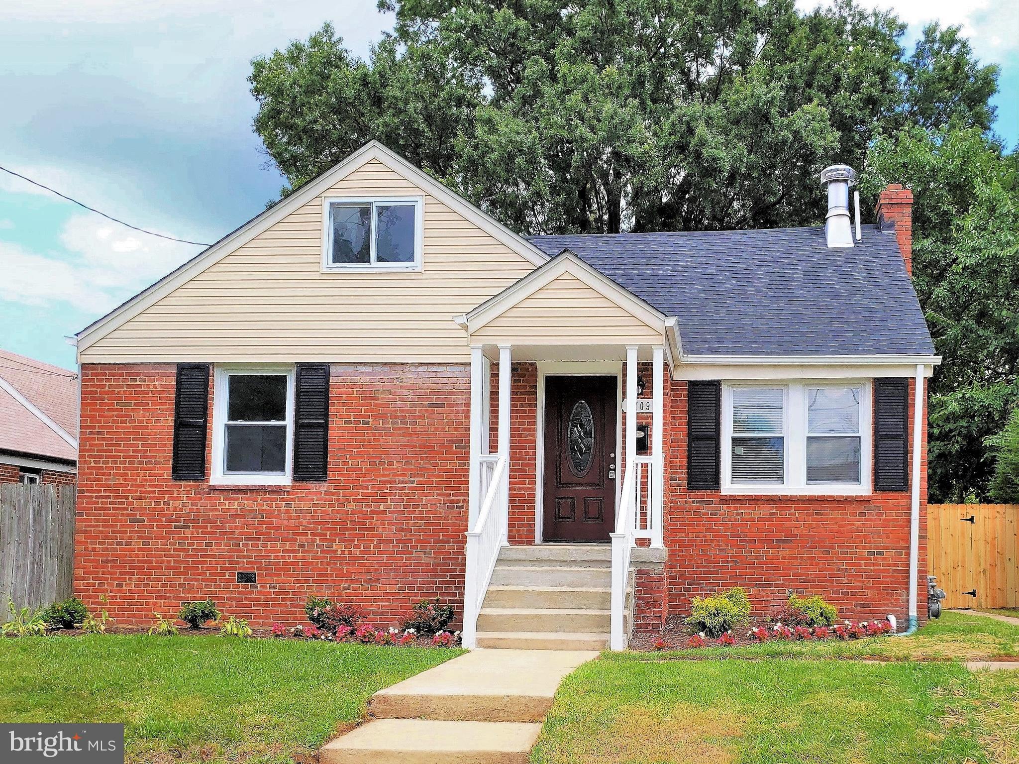 4709 68th Avenue Hyattsville, MD 20784 - Photo 1 of 30 a front view of a house with garden
