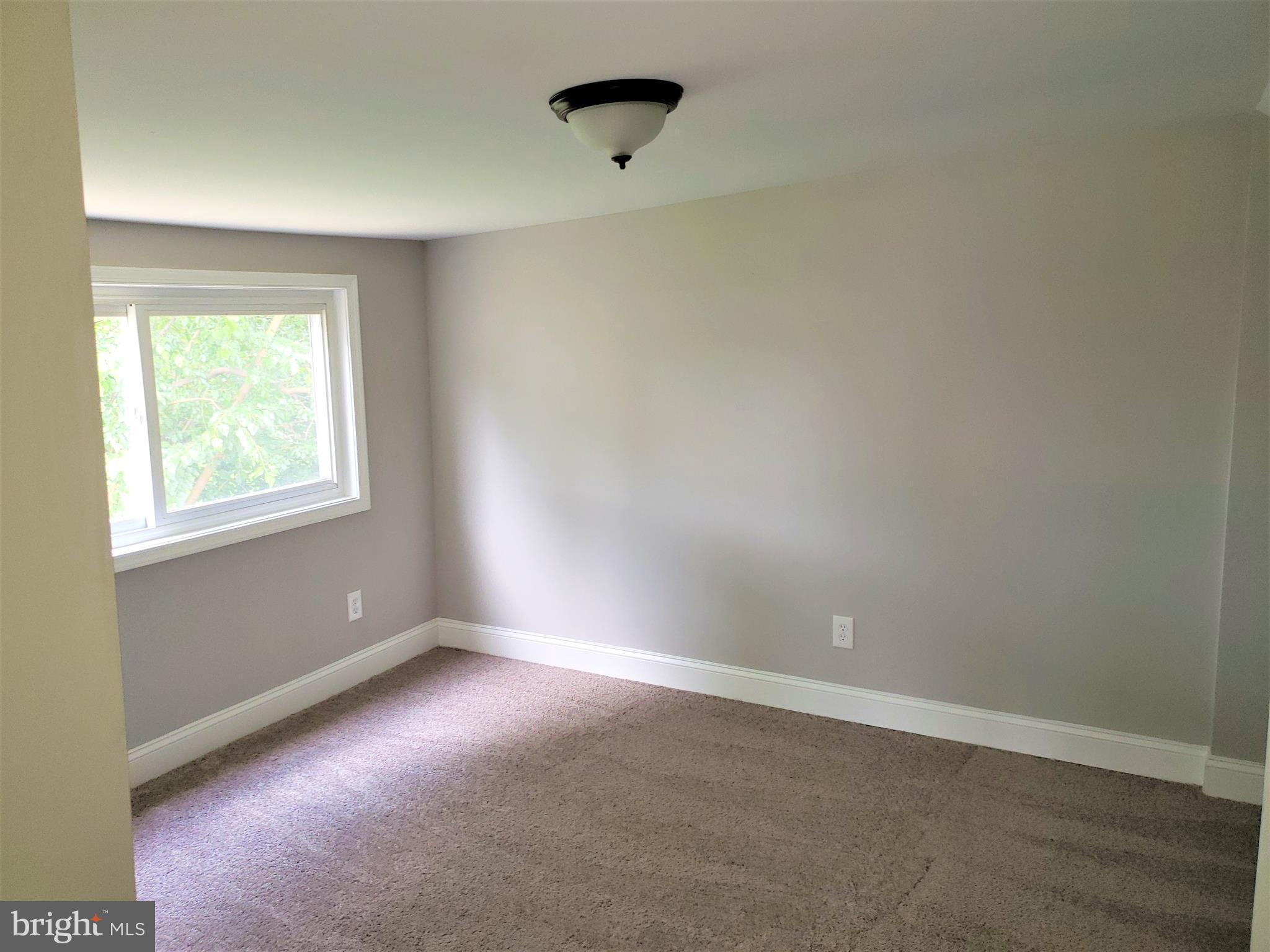 4709 68th Avenue Hyattsville, MD 20784 - Photo 19 of 30 an empty room with windows
