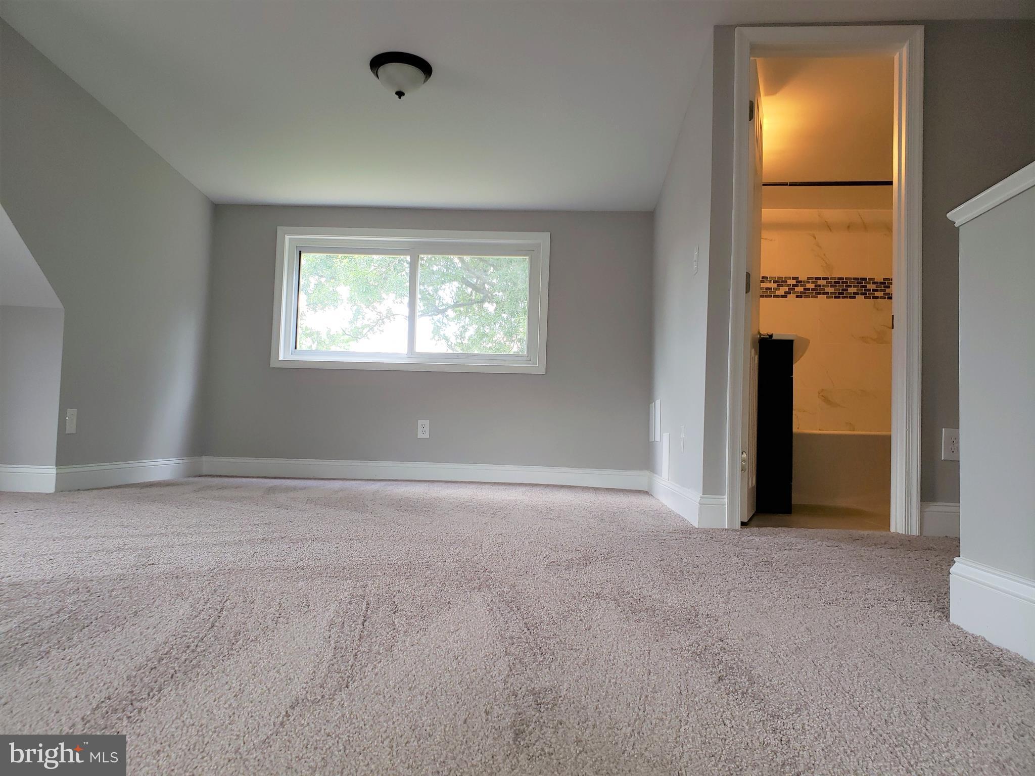 4709 68th Avenue Hyattsville, MD 20784 - Photo 22 of 30 an empty room with windows and closet