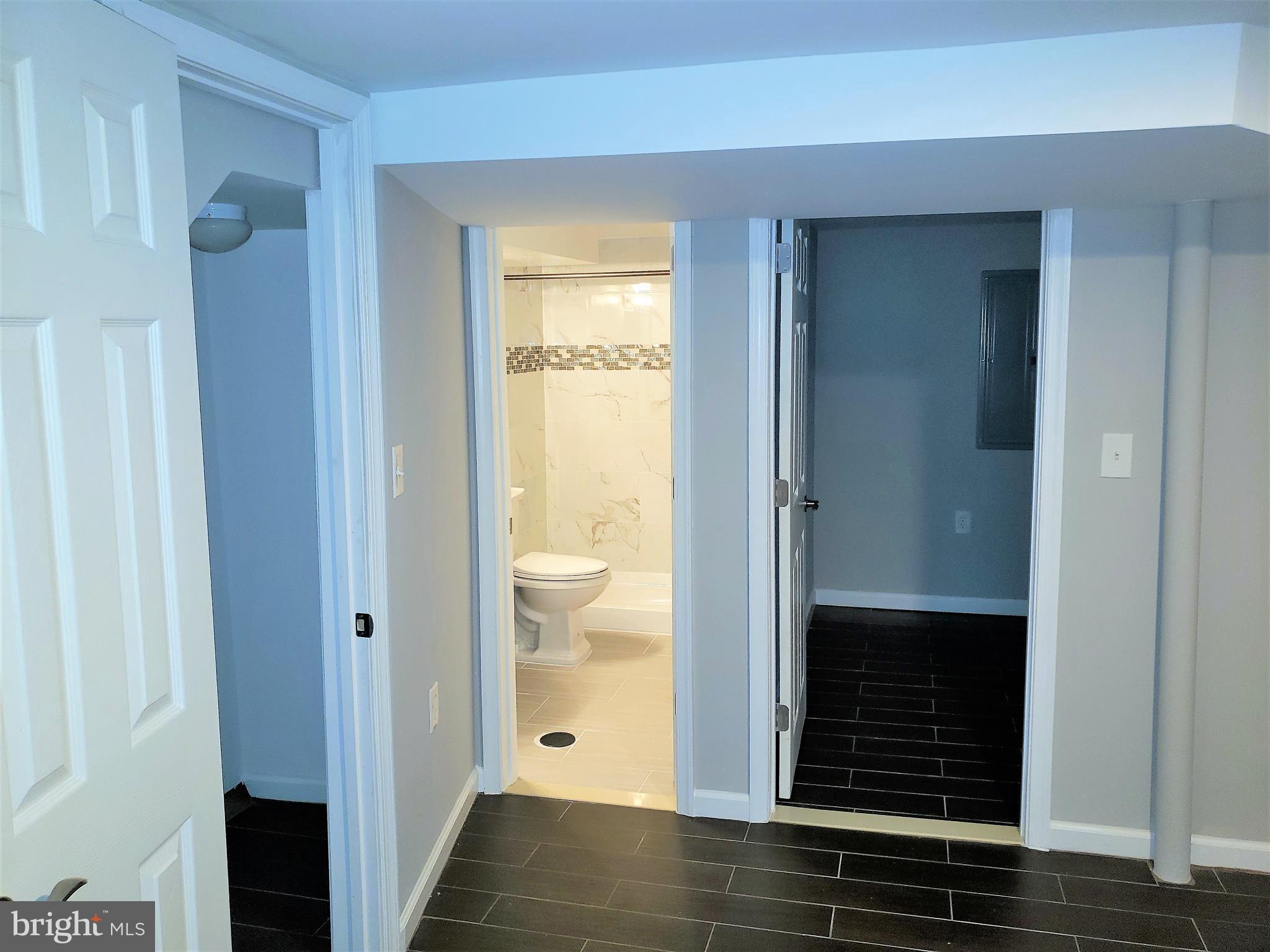 4709 68th Avenue Hyattsville, MD 20784 - Photo 27 of 30 a view of a bathroom with a glass door