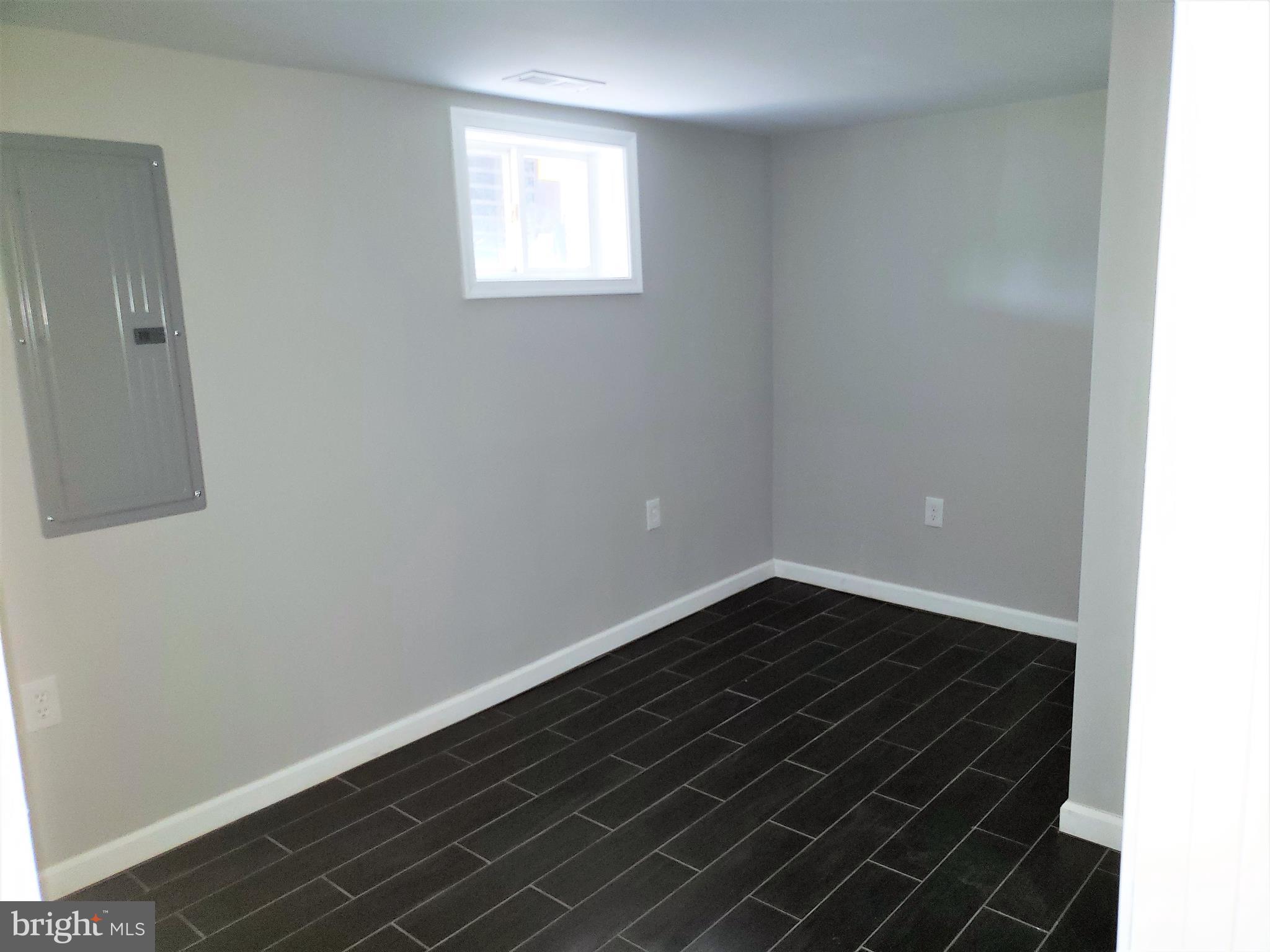 4709 68th Avenue Hyattsville, MD 20784 - Photo 29 of 30 a view of an empty room with wooden floor