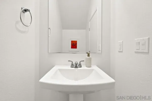 a white sink sitting next to a white sink
