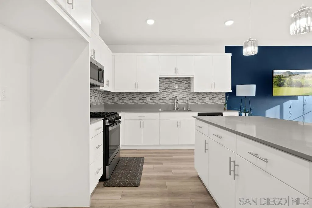 347 Sweet Place Fallbrook, CA 92028 - Photo 23 of 33 a kitchen with a sink and cabinets