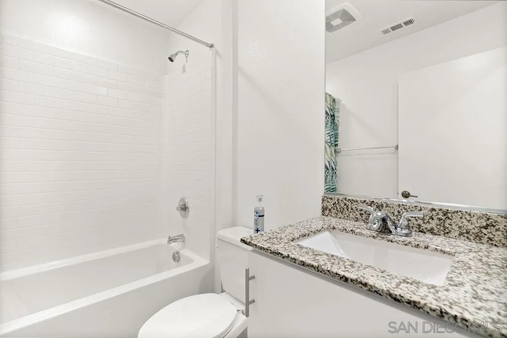 347 Sweet Place Fallbrook, CA 92028 - Photo 33 of 33 a bathroom with a granite countertop tub sink and mirror