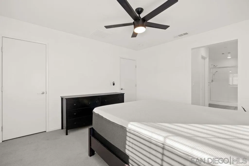 347 Sweet Place Fallbrook, CA 92028 - Photo 10 of 33 a room with a bed and a ceiling fan