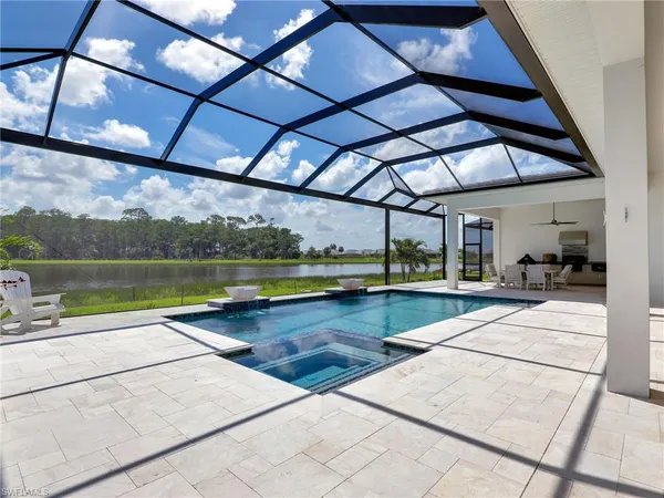 a view of a swimming pool with a patio