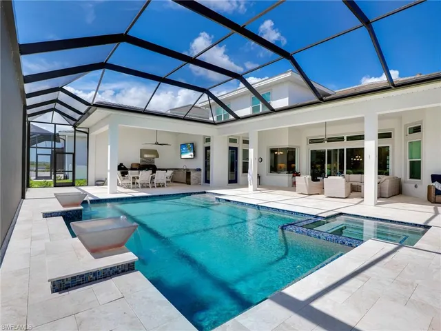 a view of swimming pool with outdoor seating