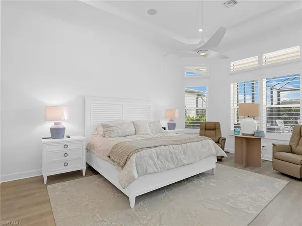 a bedroom with a bed and a couch