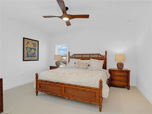 a bedroom with a bed and a desk