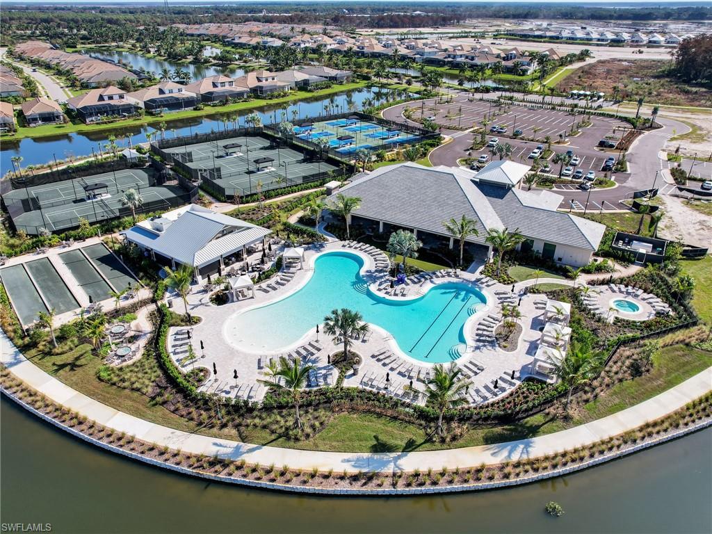 15432 Turin Drive Naples, FL 34114 - Photo 35 of 45 an aerial view of residential houses with outdoor space