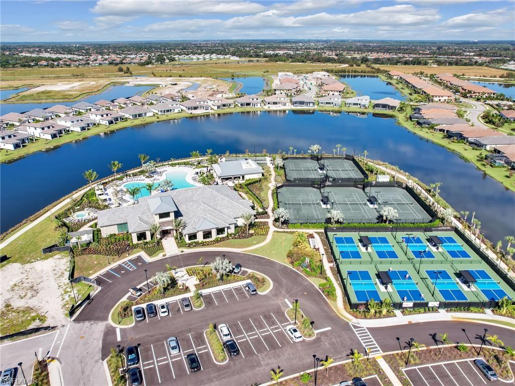 15432 Turin Drive Naples, FL 34114 - Photo 37 of 45 an aerial view of a swimming pool with an outdoor seating