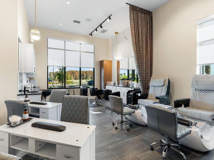 15432 Turin Drive Naples, FL 34114 - Photo 39 of 45 a living room with furniture and large windows