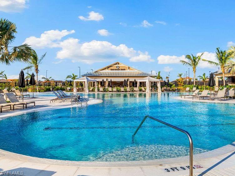 15432 Turin Drive Naples, FL 34114 - Photo 40 of 45 a view of swimming pool with outdoor seating