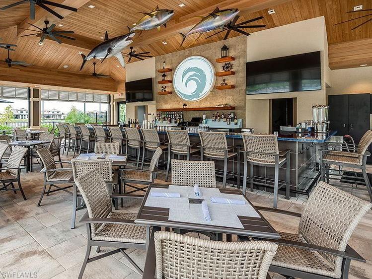 15432 Turin Drive Naples, FL 34114 - Photo 42 of 45 a view of a dining room with furniture