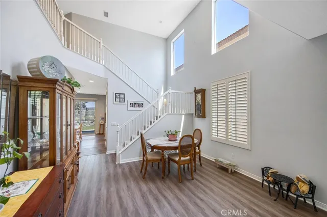 a view of a livingroom with furniture and hardwood floor