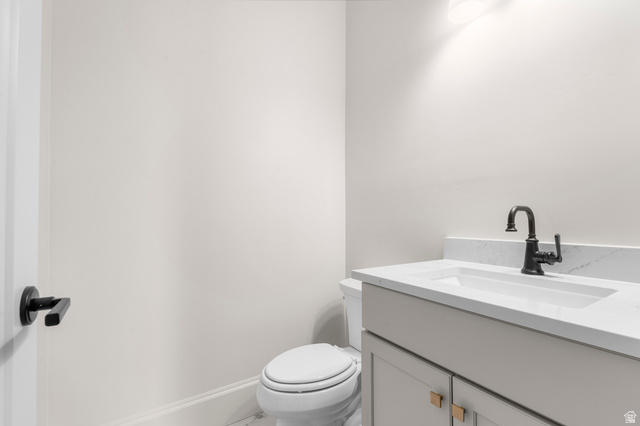 11718 South Halls Crk Road Draper, UT 84020 - Photo 12 of 28 Bathroom featuring a contemporary vanity with an integrated sink, matte black faucet, and a light-toned countertop