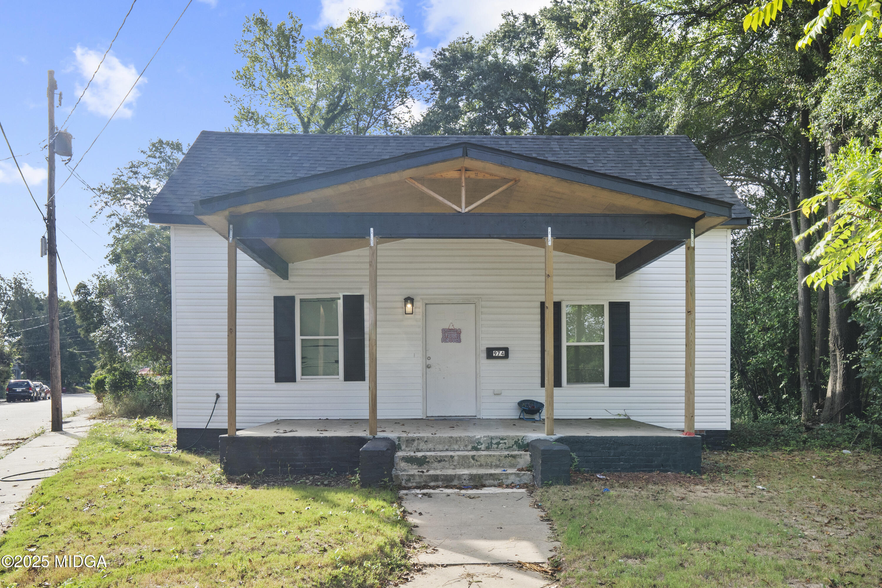 a front view of a house with garden