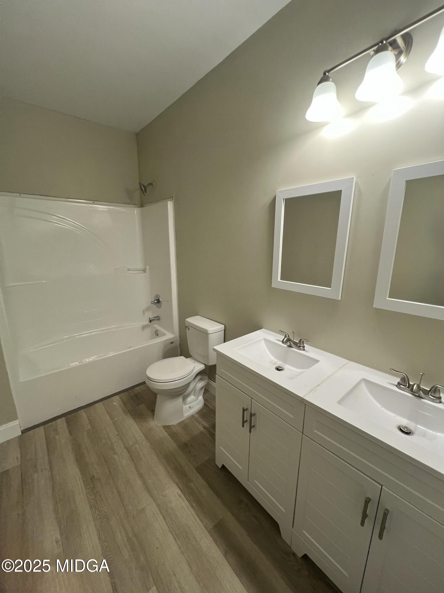974 Tenney Avenue Macon, GA 31201 - Photo 4 of 6 a bathroom with a sink a toilet and shower