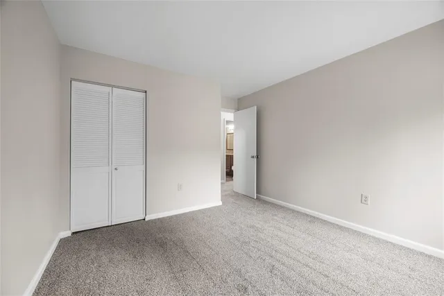 a view of an empty room and entryway