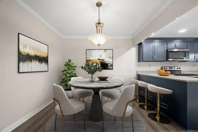 a dining room with furniture and window