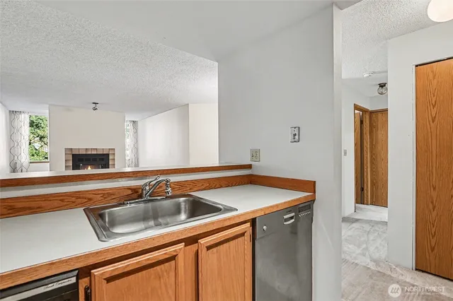 a view of an empty room with a fireplace