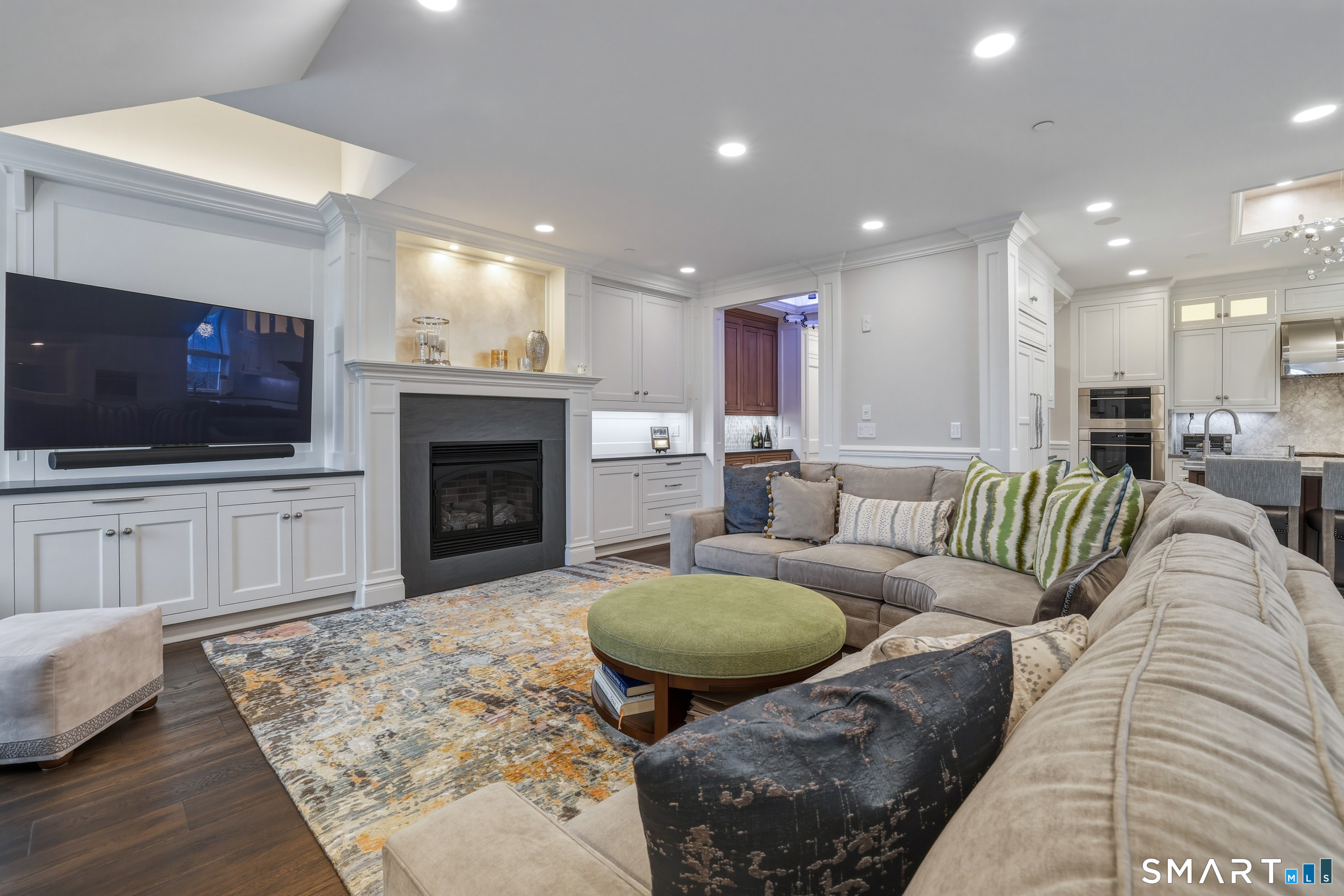 66 High Street, Unit 38 Guilford, CT 06437 - Photo 12 of 40 a living room with furniture and a flat screen tv