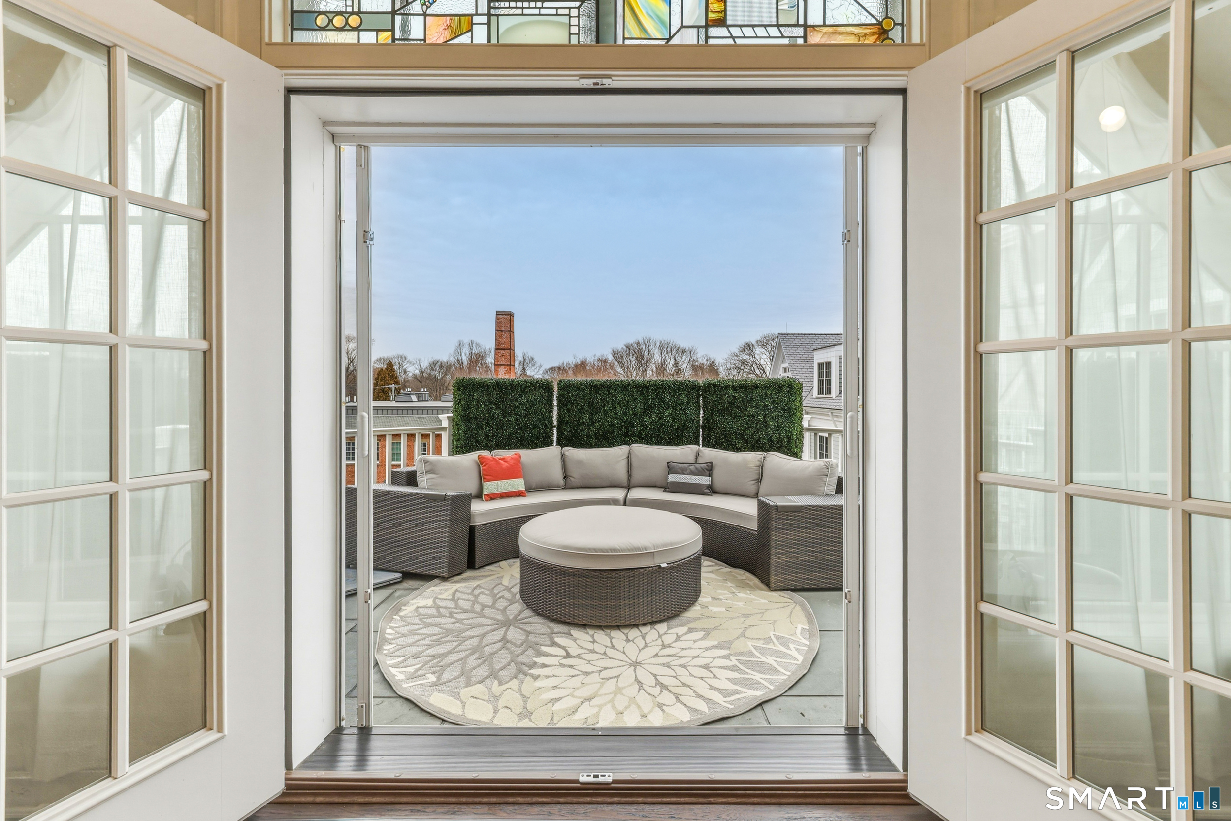 66 High Street, Unit 38 Guilford, CT 06437 - Photo 15 of 40 a living room with furniture and a floor to ceiling window