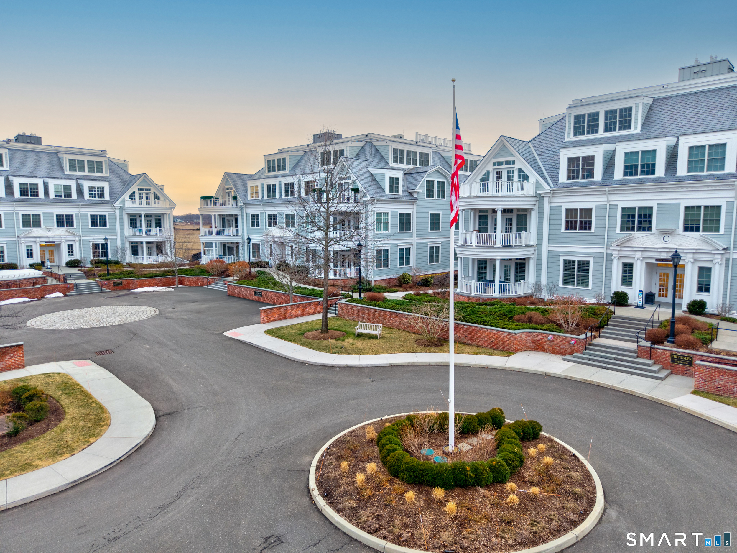 66 High Street, Unit 38 Guilford, CT 06437 - Photo 2 of 40 a swimming pool with buildings in the background