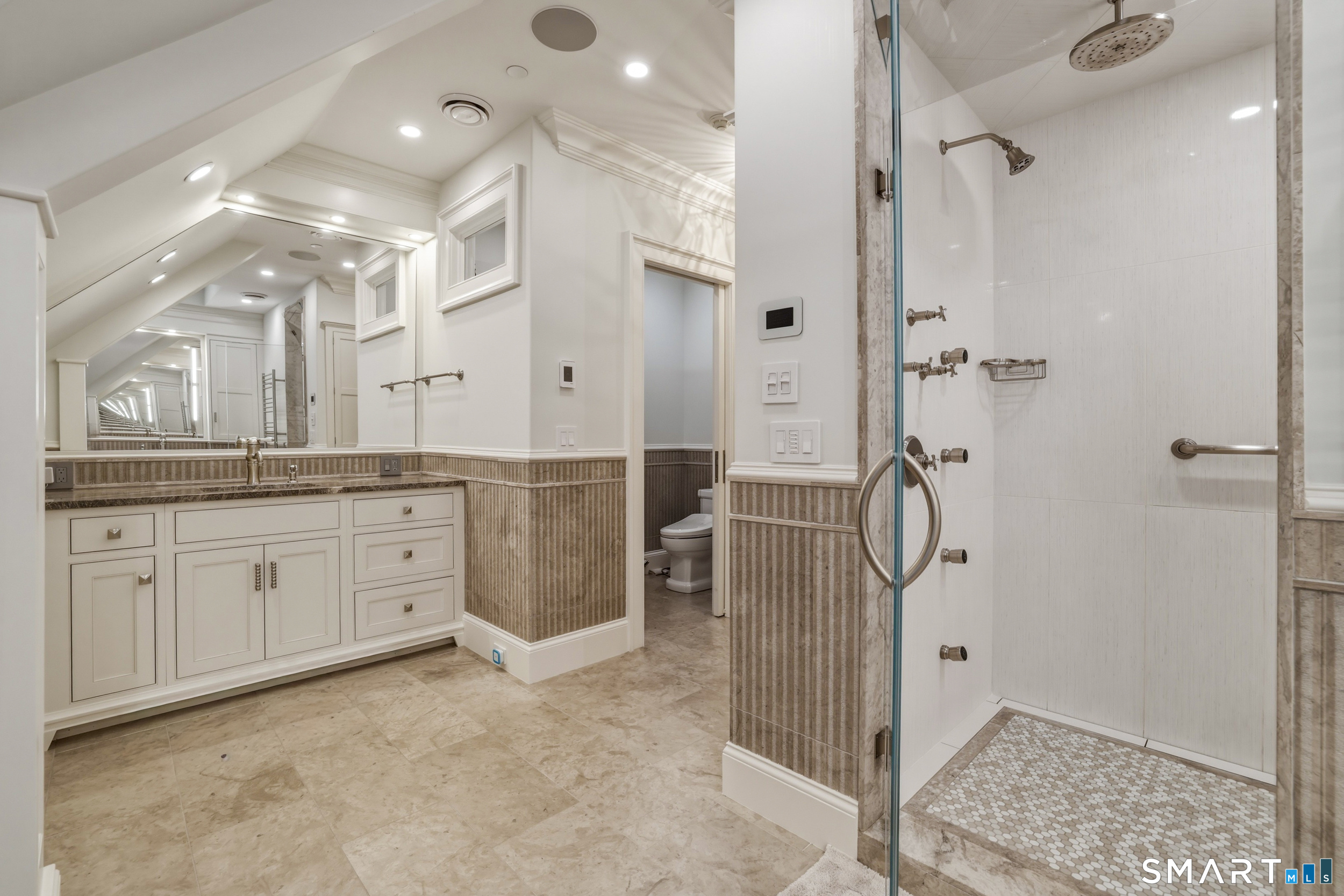 66 High Street, Unit 38 Guilford, CT 06437 - Photo 23 of 40 a spacious bathroom with a granite countertop sink mirror and shower