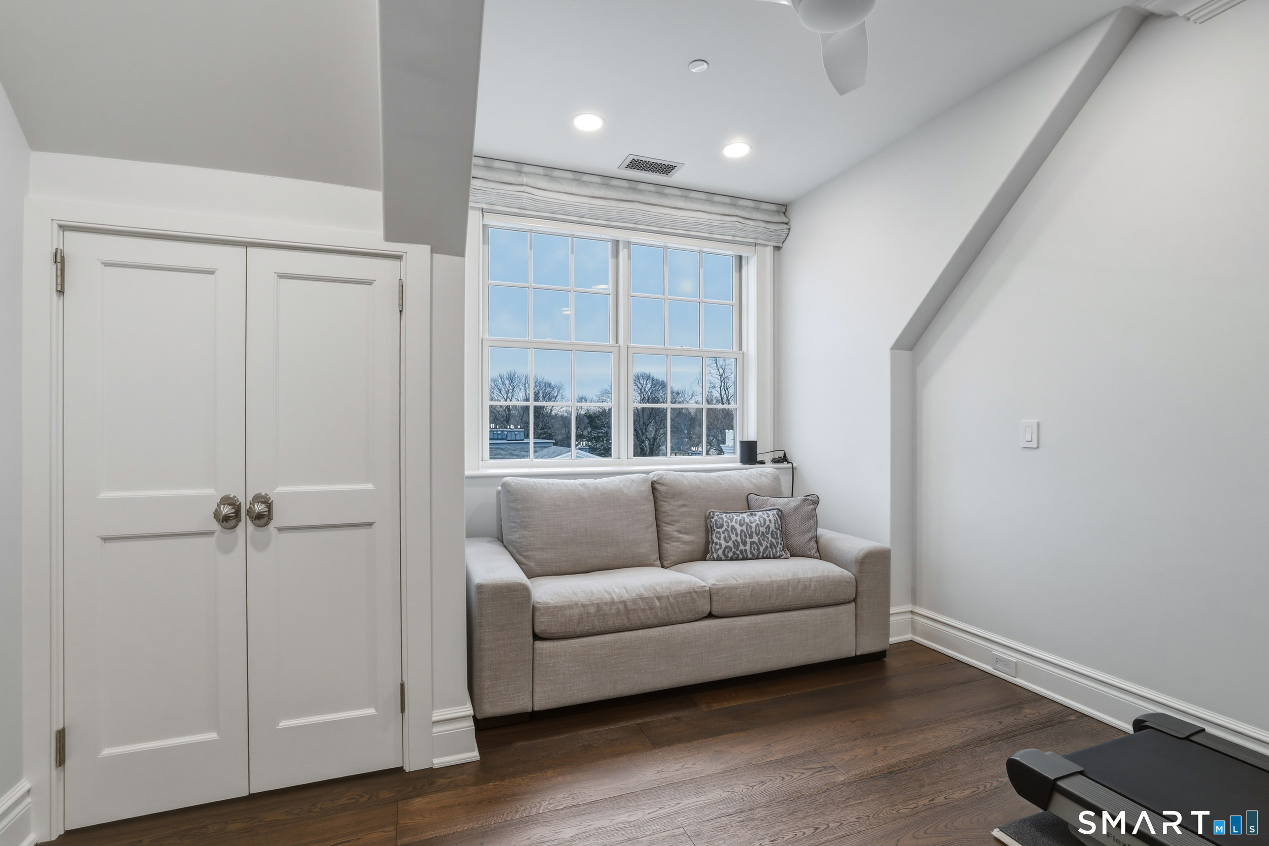66 High Street, Unit 38 Guilford, CT 06437 - Photo 28 of 40 a living room with furniture and a wooden floor