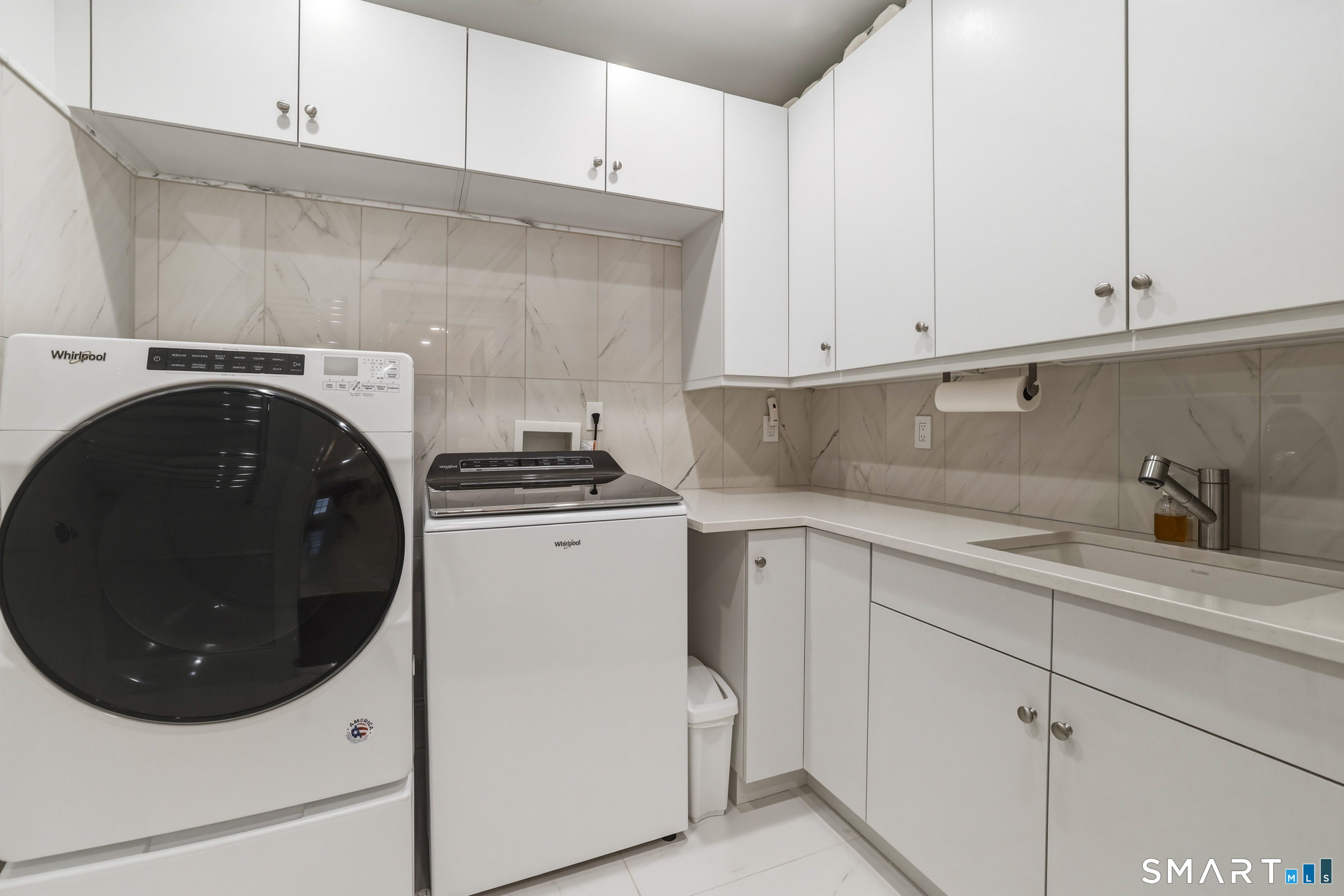 66 High Street, Unit 38 Guilford, CT 06437 - Photo 30 of 40 a kitchen with white cabinets and white appliances