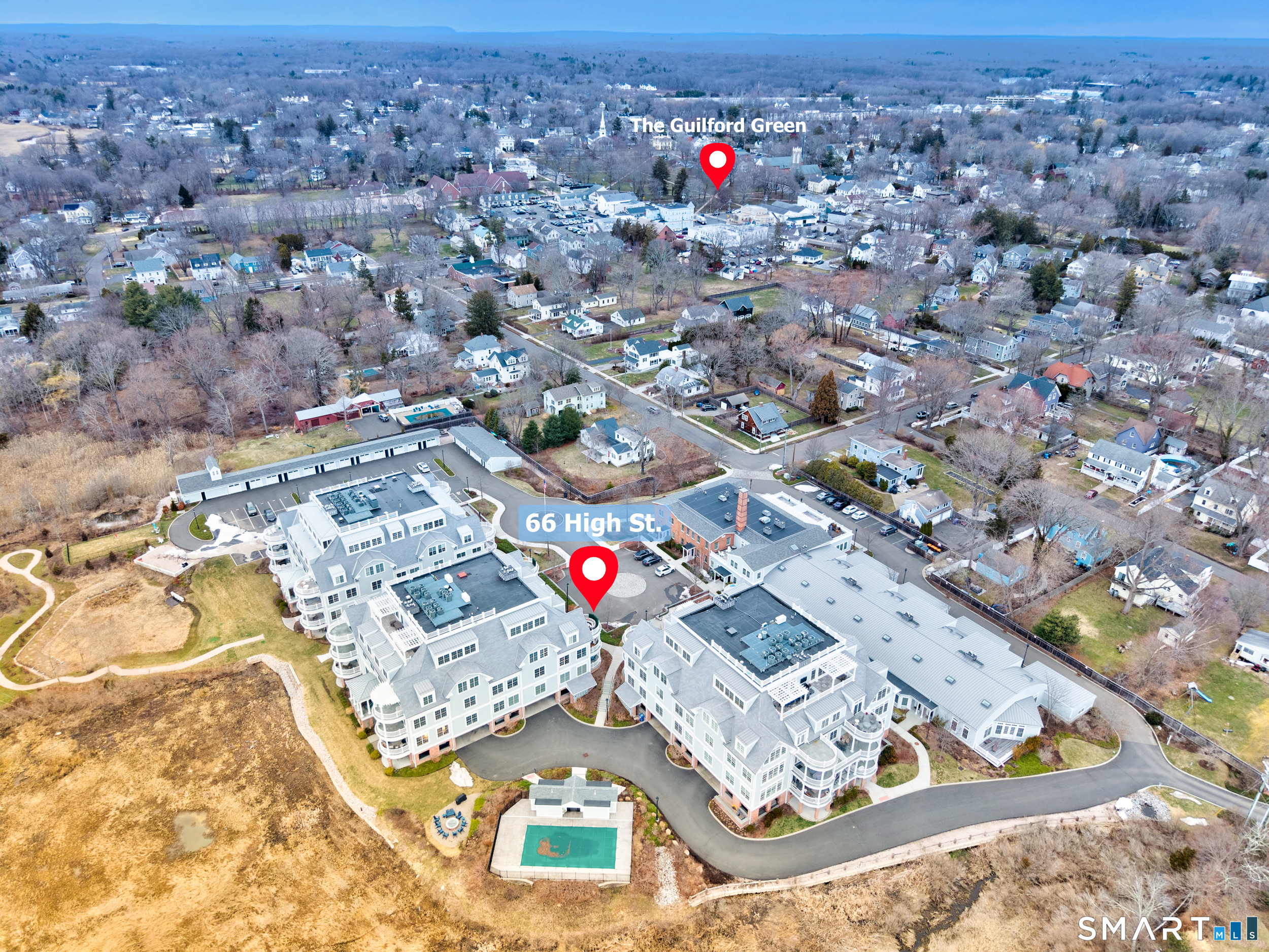 66 High Street, Unit 38 Guilford, CT 06437 - Photo 32 of 40 an aerial view of residential houses with outdoor space
