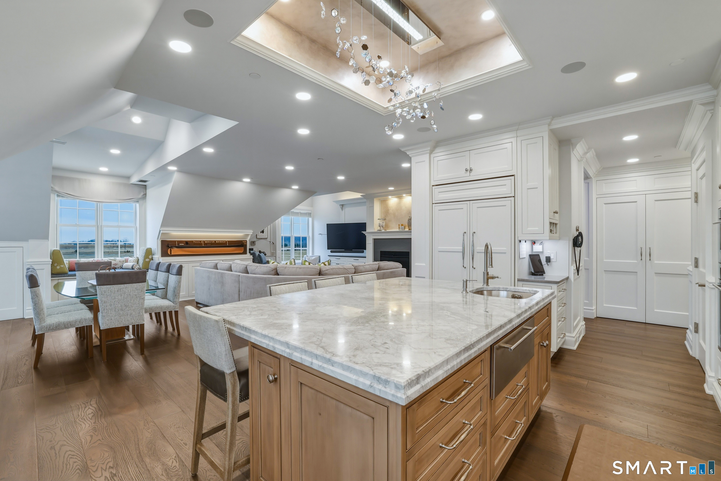 66 High Street, Unit 38 Guilford, CT 06437 - Photo 9 of 40 a large kitchen with kitchen island a island a sink a counter space and stainless steel appliances