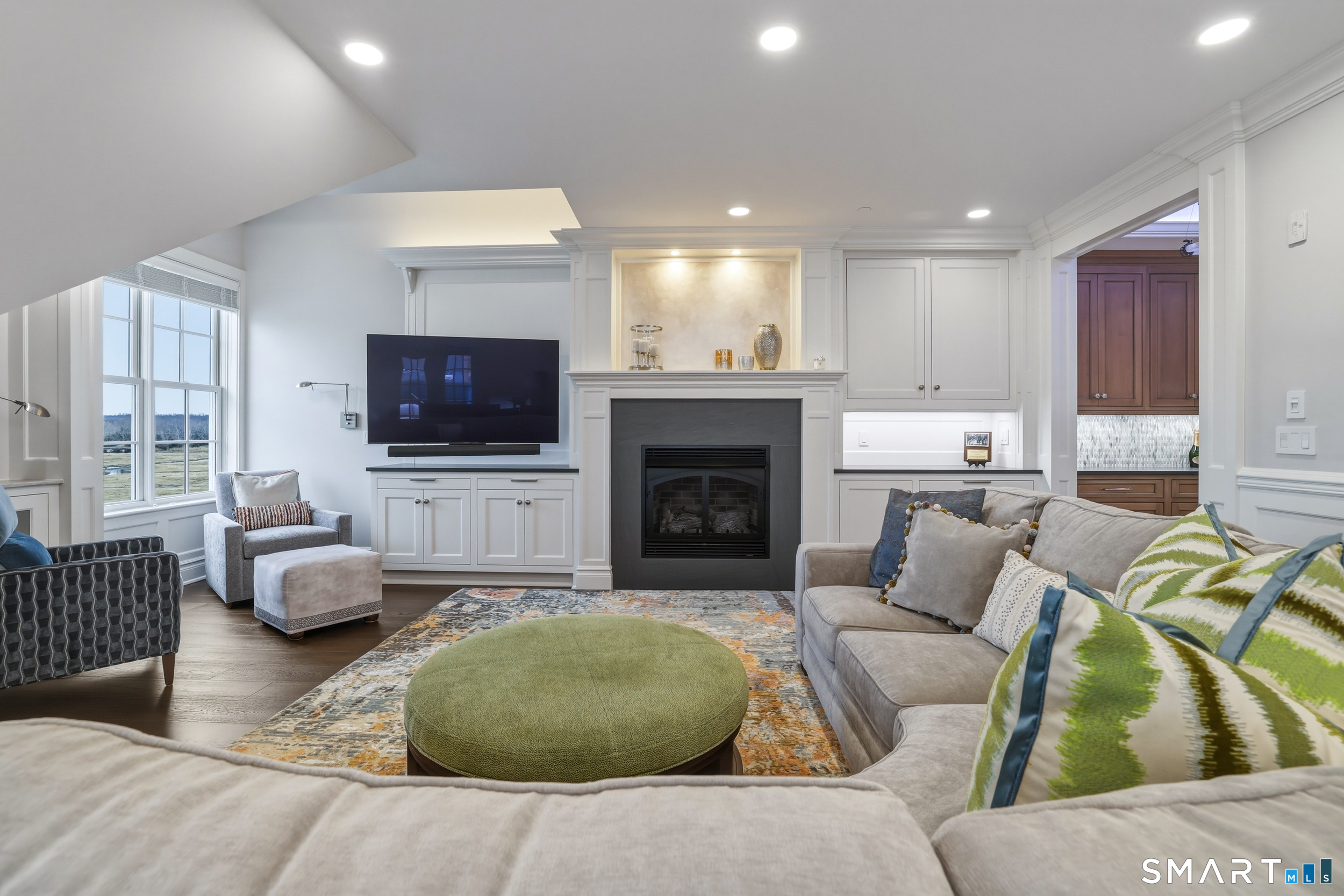66 High Street, Unit 38 Guilford, CT 06437 - Photo 10 of 40 a living room with furniture and a flat screen tv