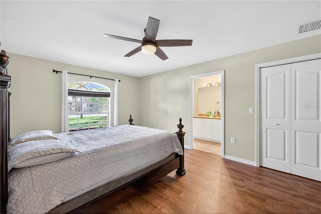 1429 Laredo Avenue Spring Hill, FL 34608 - Photo 15 of 28 a bedroom with a bed and a window