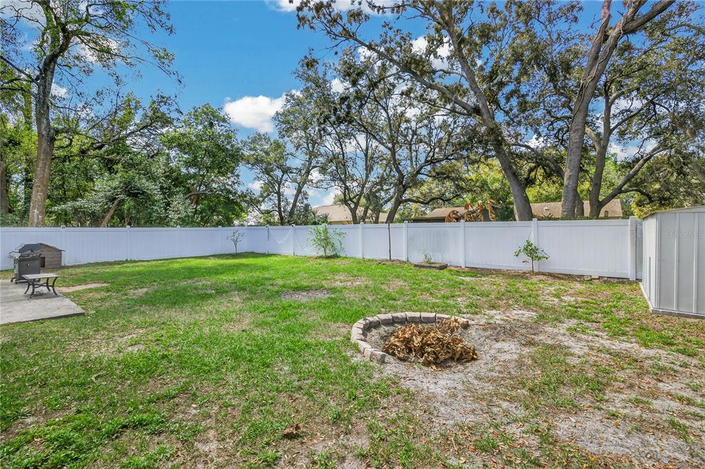 1429 Laredo Avenue Spring Hill, FL 34608 - Photo 24 of 28 a view of backyard with wooden fence