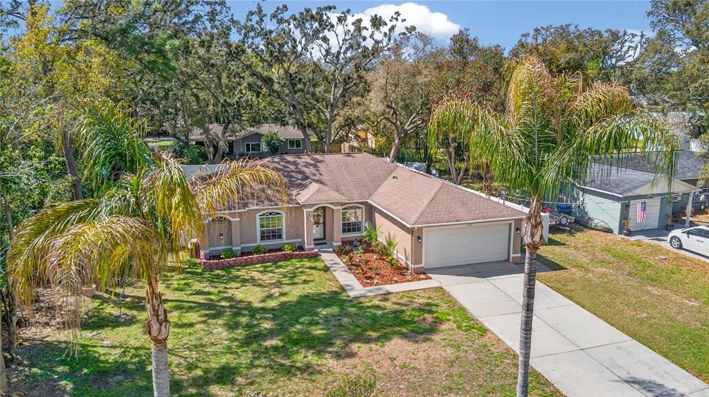 1429 Laredo Avenue Spring Hill, FL 34608 - Photo 26 of 28 a aerial view of a house next to a yard