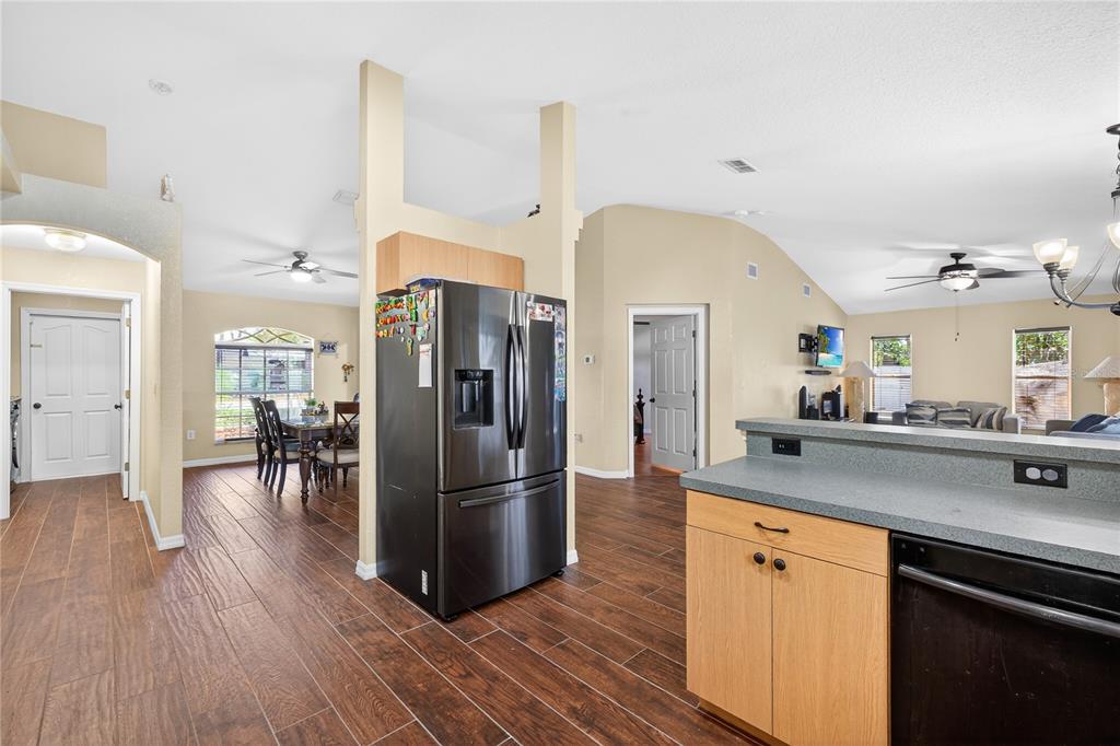1429 Laredo Avenue Spring Hill, FL 34608 - Photo 6 of 28 a kitchen with stainless steel appliances a refrigerator and a sink
