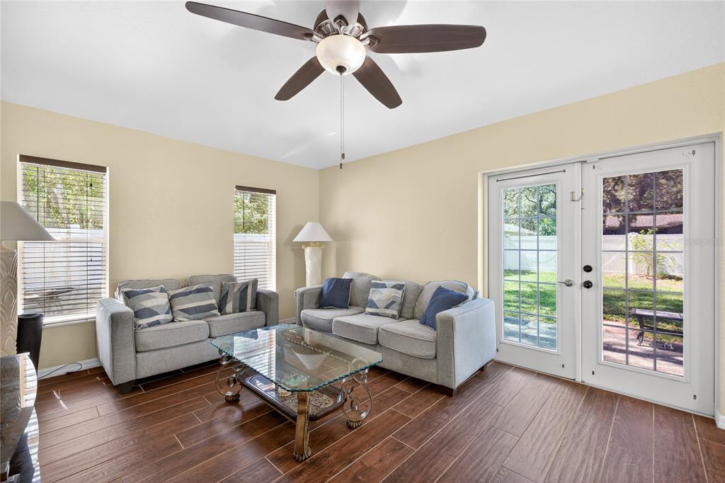 1429 Laredo Avenue Spring Hill, FL 34608 - Photo 9 of 28 a living room with furniture and a large window