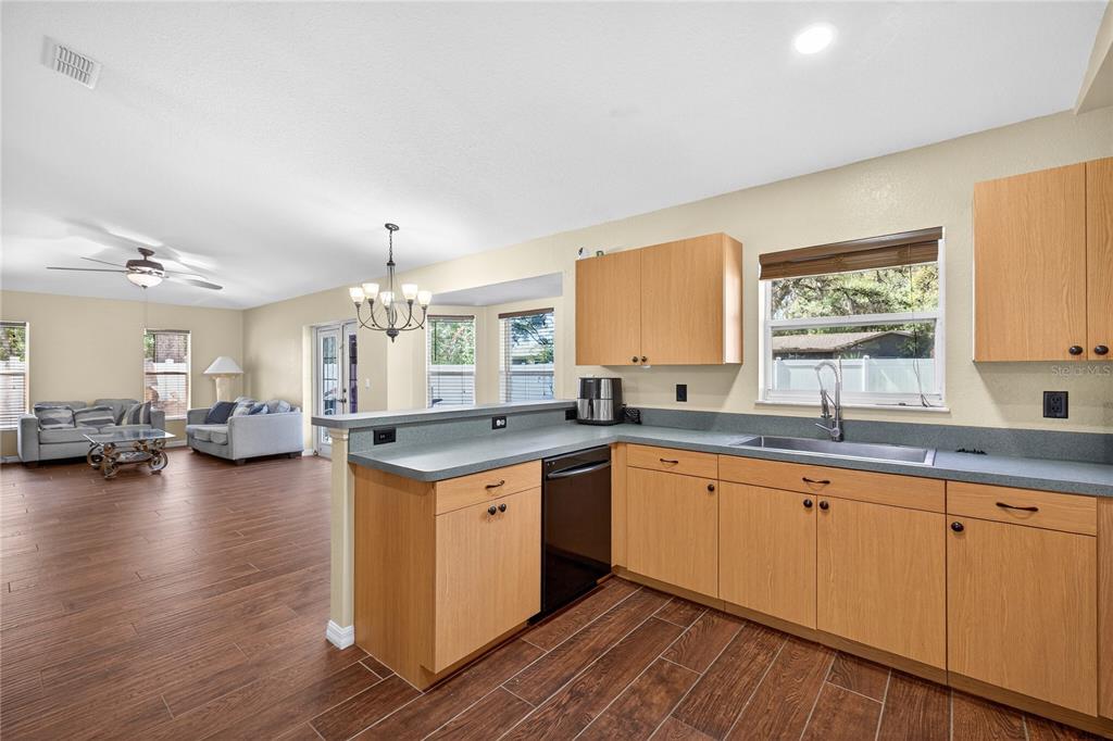 1429 Laredo Avenue Spring Hill, FL 34608 - Photo 10 of 28 a open kitchen with sink cabinets and wooden floor