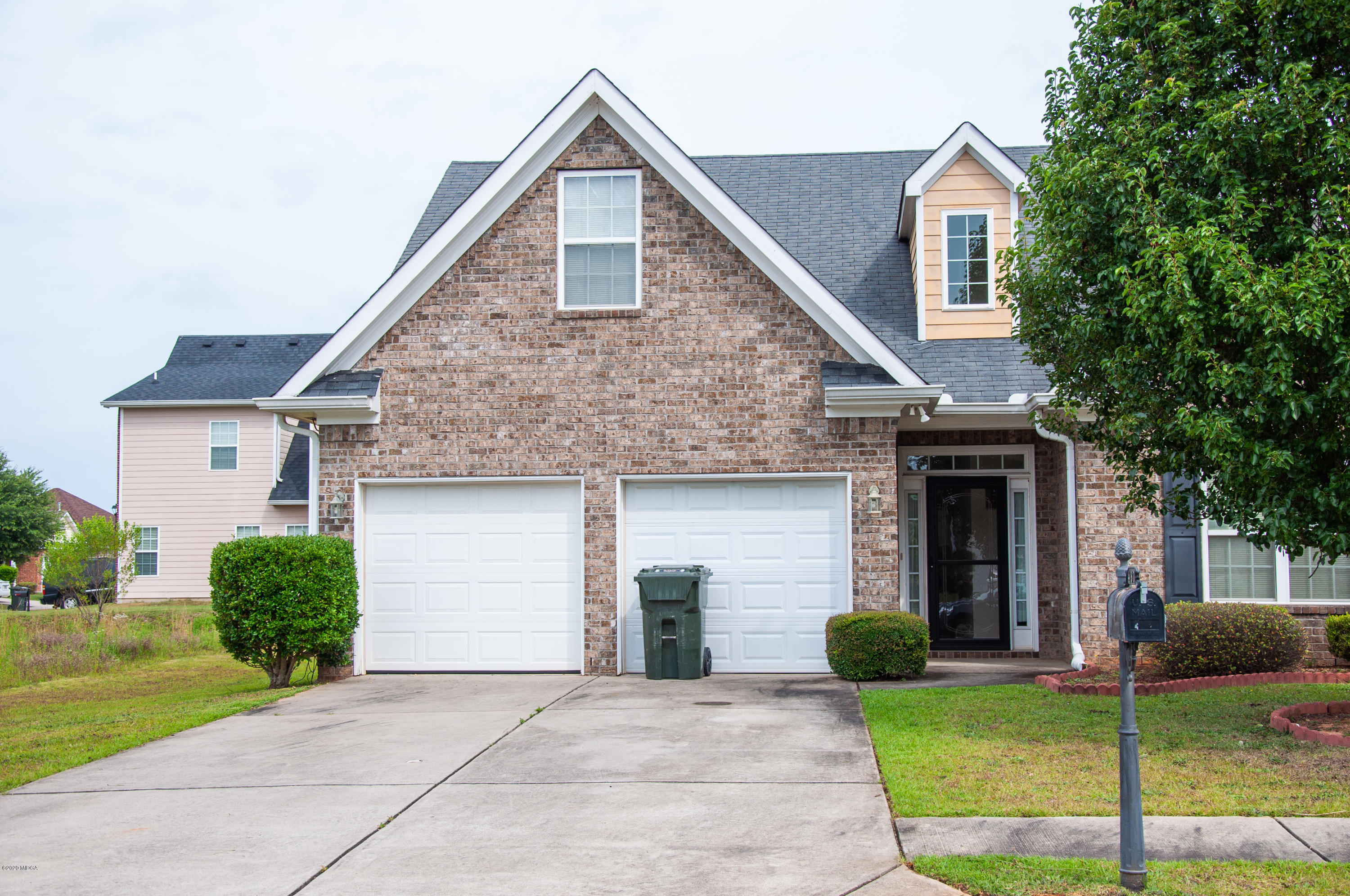 480 Bob White Road Macon, GA 31216 - Photo 1 of 28 a front view of a house with a yard and garage