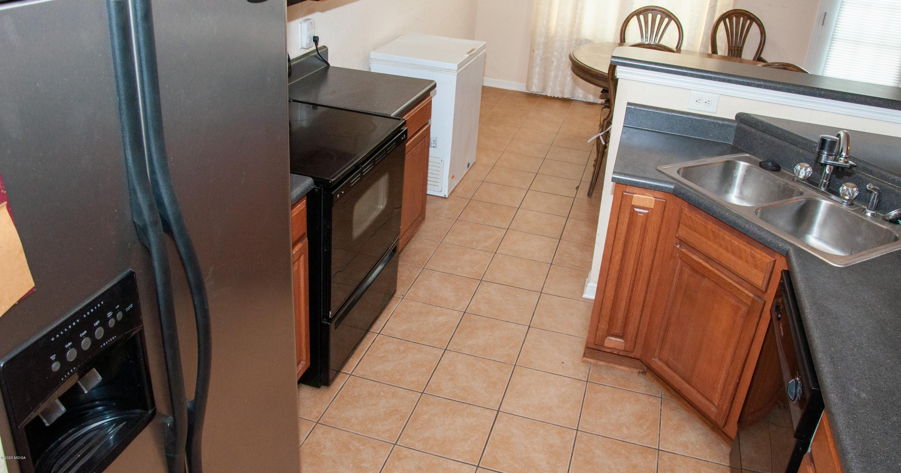480 Bob White Road Macon, GA 31216 - Photo 14 of 28 a kitchen with a sink and washing machine
