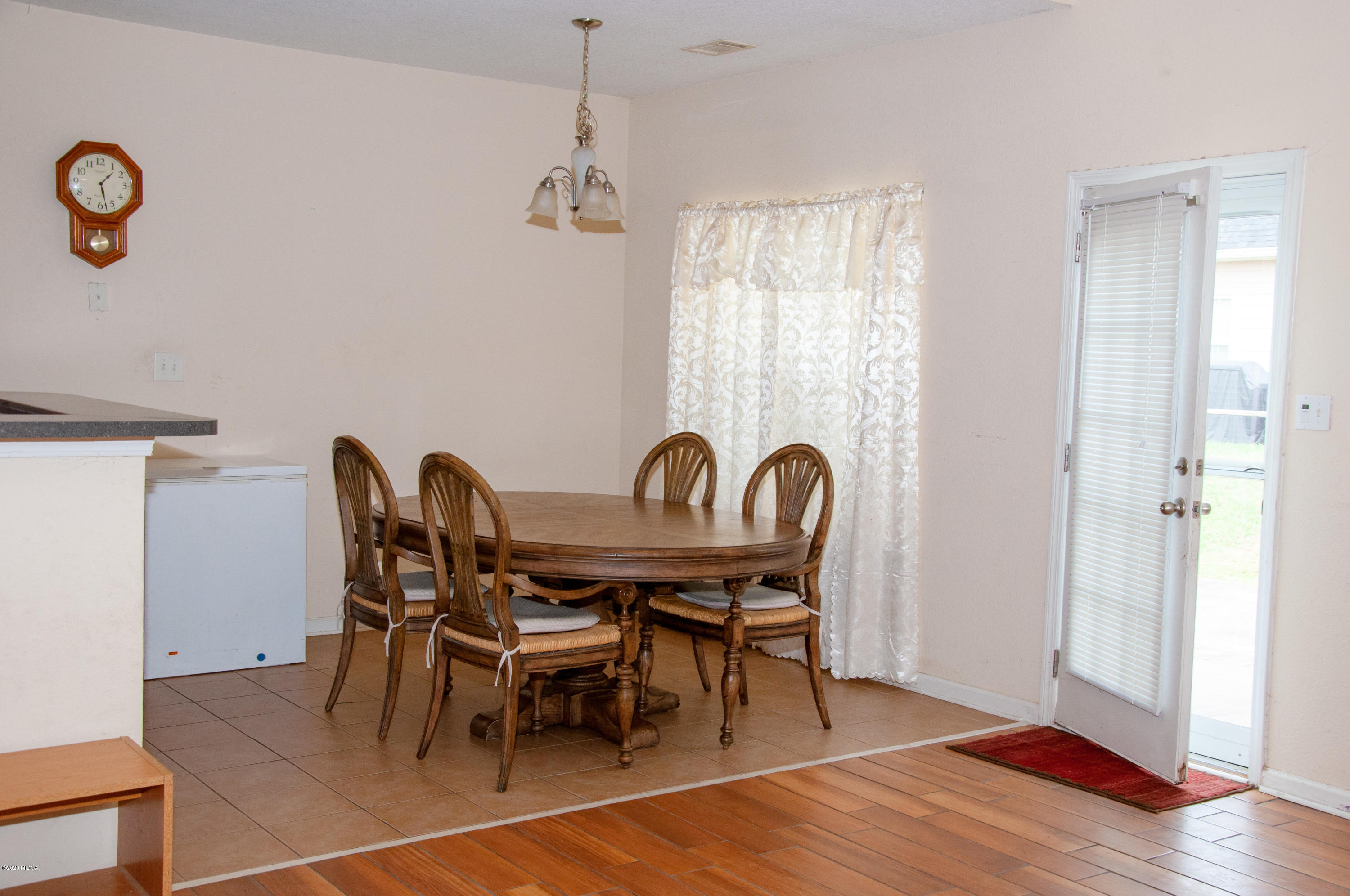 480 Bob White Road Macon, GA 31216 - Photo 17 of 28 a view of a dining room with furniture and wooden floor