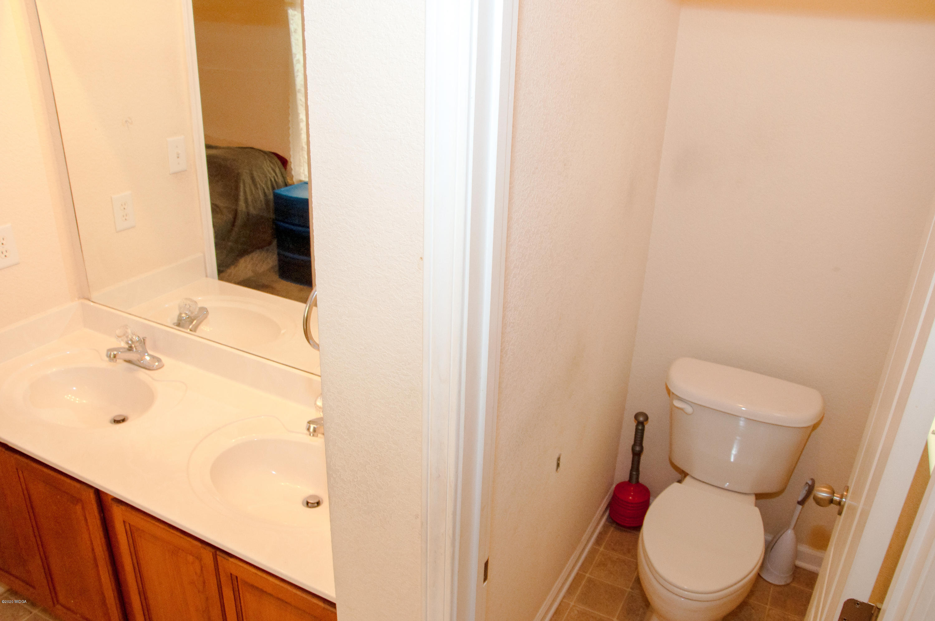 480 Bob White Road Macon, GA 31216 - Photo 21 of 28 a white toilet sitting next to a bathroom sink