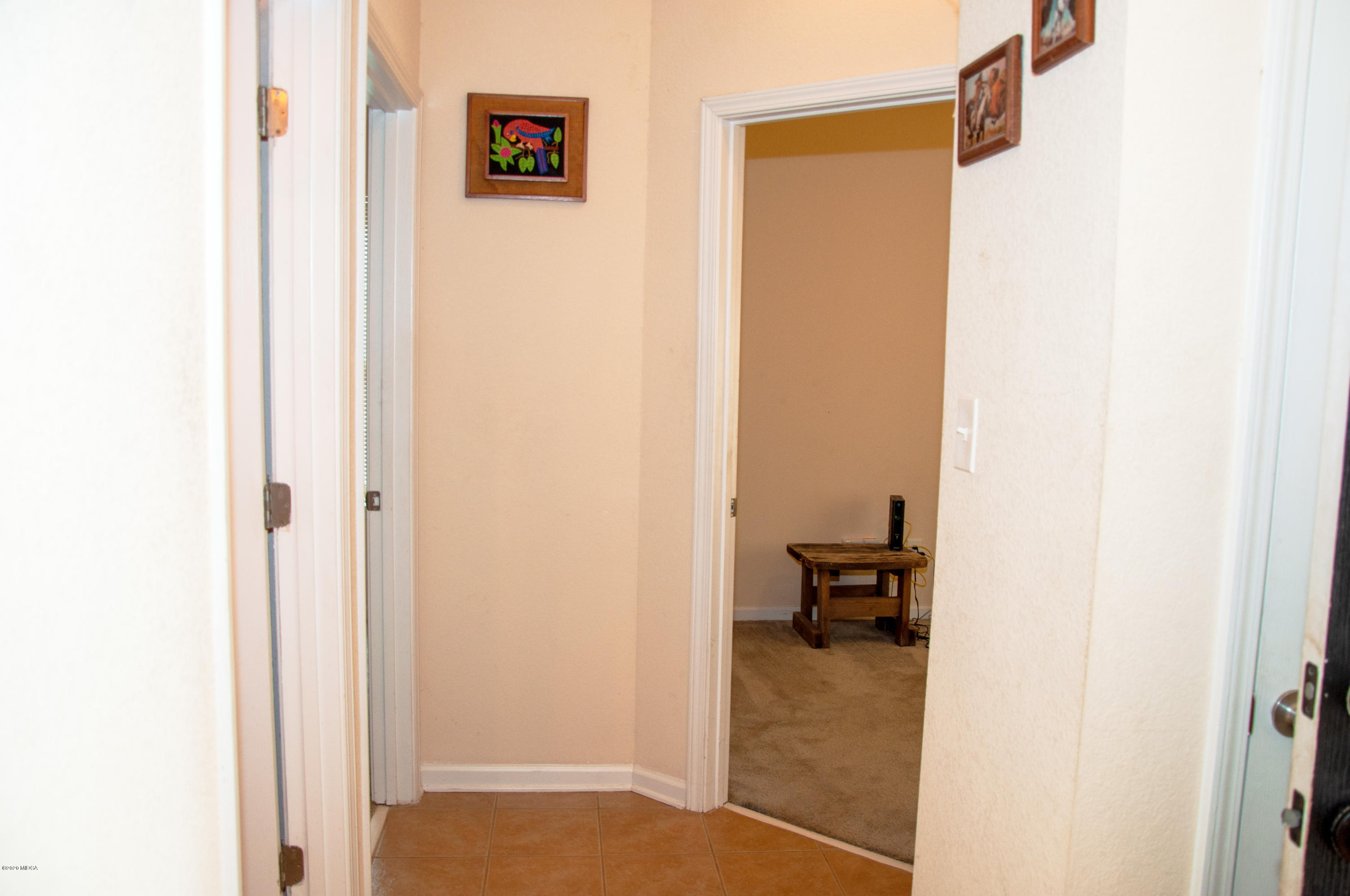 480 Bob White Road Macon, GA 31216 - Photo 5 of 28 a view of a hallway with couch and a closet