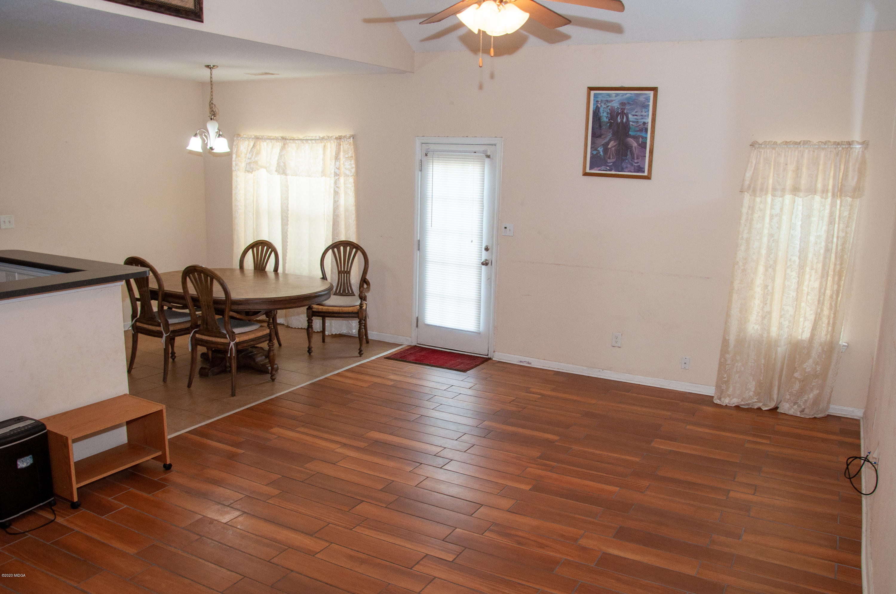 480 Bob White Road Macon, GA 31216 - Photo 10 of 28 a view of a livingroom with furniture wooden floor and chandelier