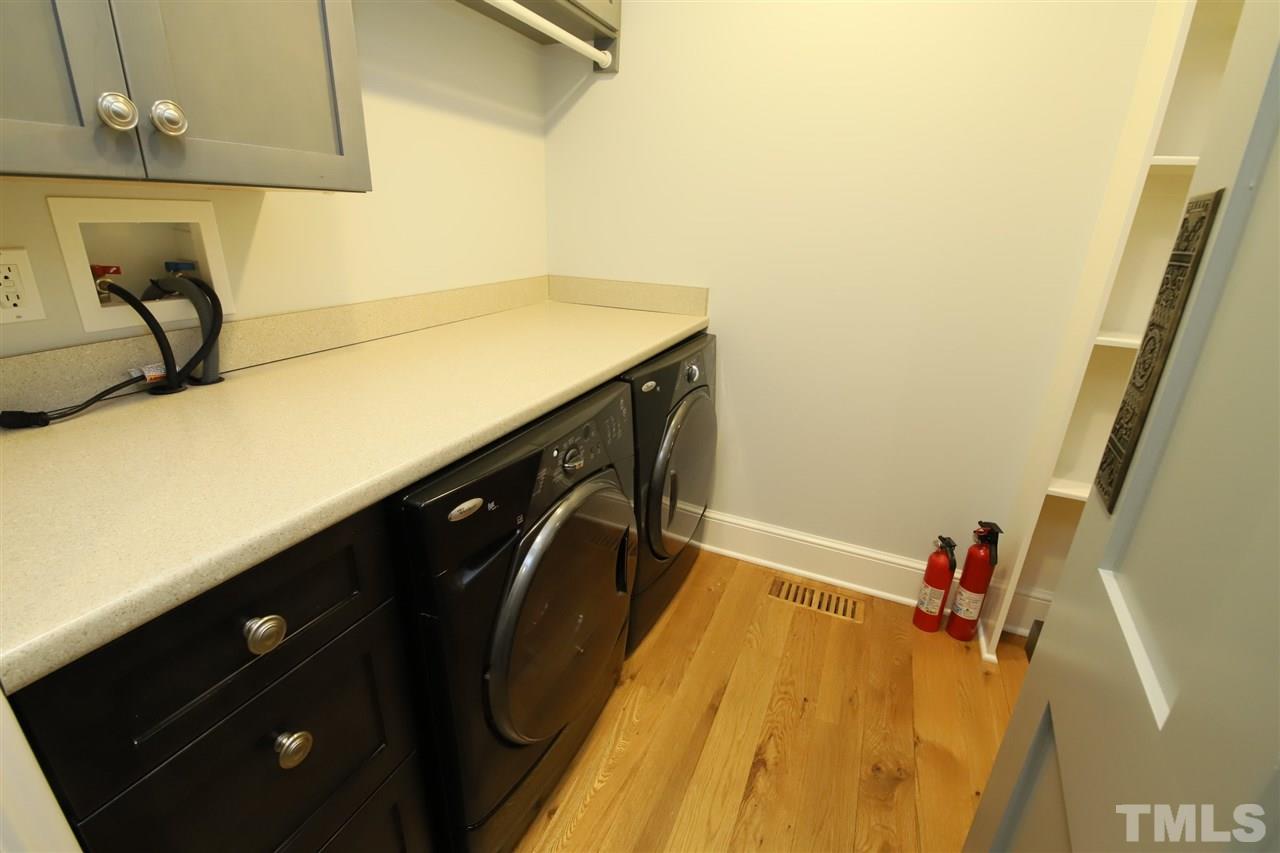 3411 Dover Road Durham, NC 27707 - Photo 15 of 29 Just across from the butlers pantry is a large walk in area with laundry facilities as well as plenty of pantry space.