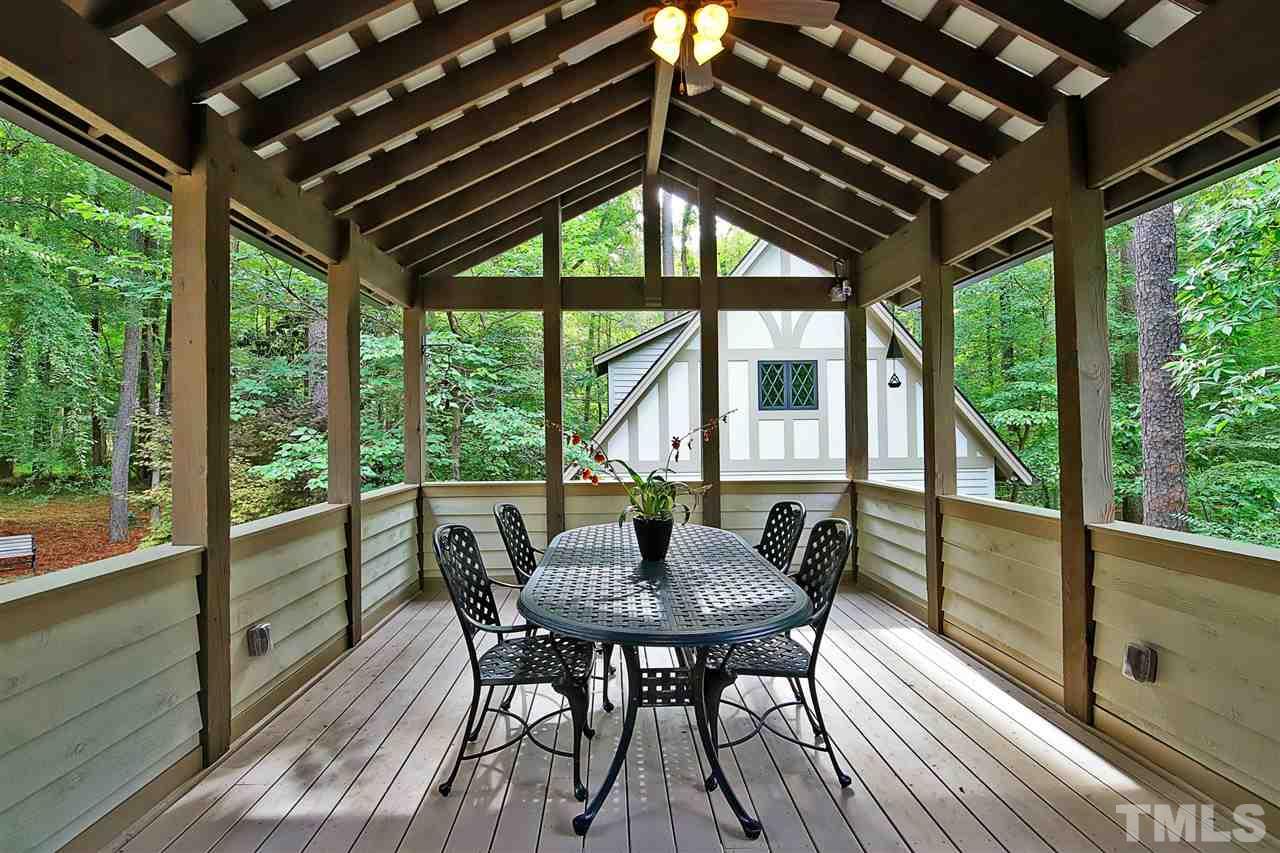 3411 Dover Road Durham, NC 27707 - Photo 16 of 29 Just off the breakfast room, doors lead to a lovely covered porch which looks out onto the rear property. Perfect for al fresco dining.